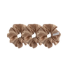 Three beige scrunchies on a white background