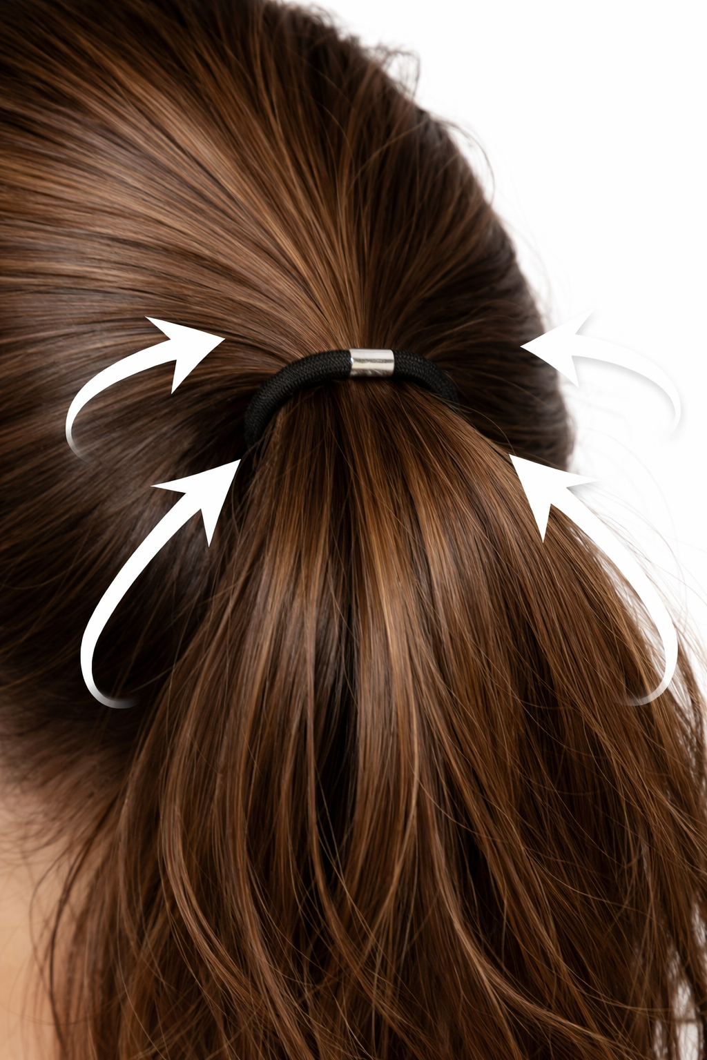 Woman tying her hair in a ponytail showing the section where hair is held, wearing an elastic band