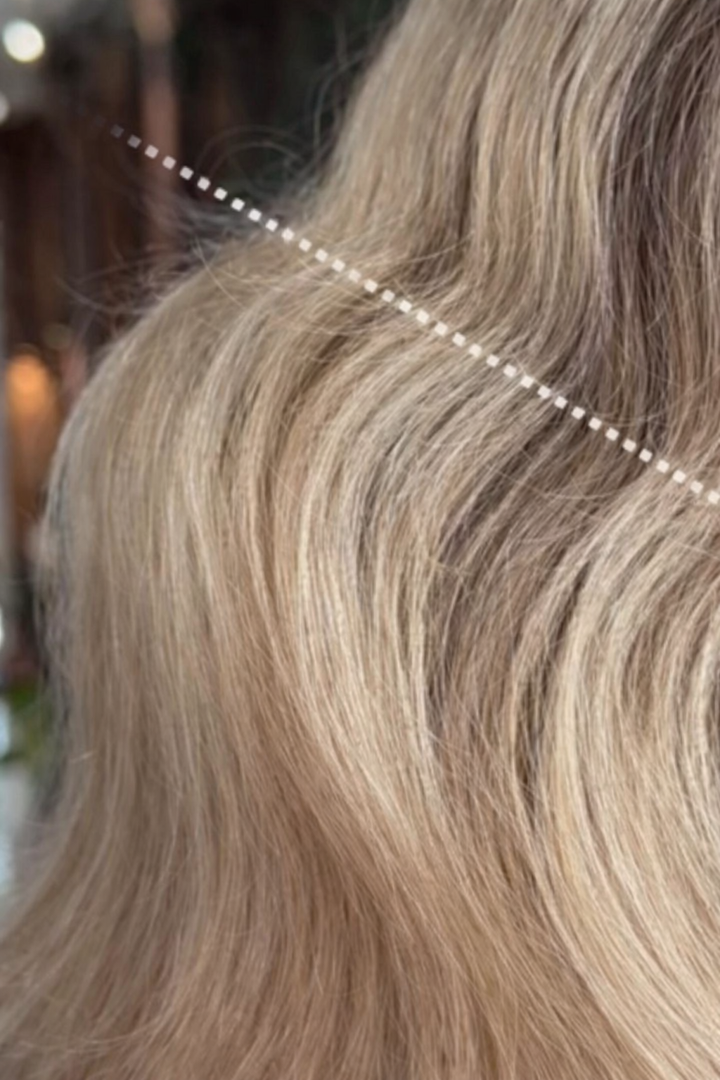 woman with hair breakage where hair tie is regularly worn provided by hairdresser