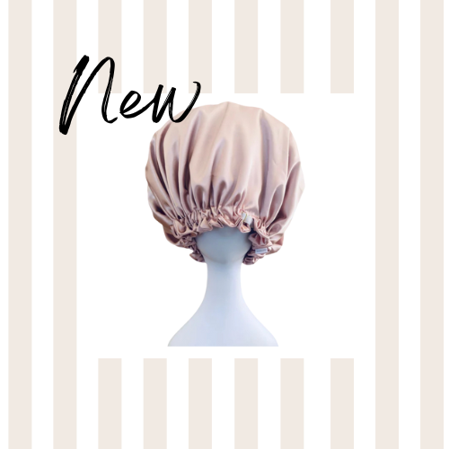 Pink satin bunluv bonnet on a mannequin head against a striped background with 'New' text.
