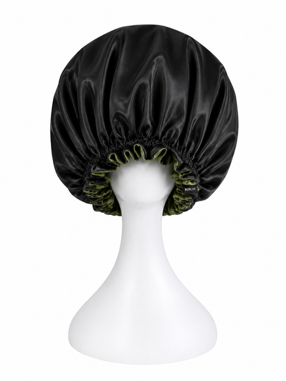 A BUNLUV black & olive green satin bonnet with adjustable elasticised inner band, displayed on a white mannequin head against a white background.
