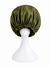 A BUNLUV olive green & black satin bonnet displayed on a white mannequin head against a plain white background.