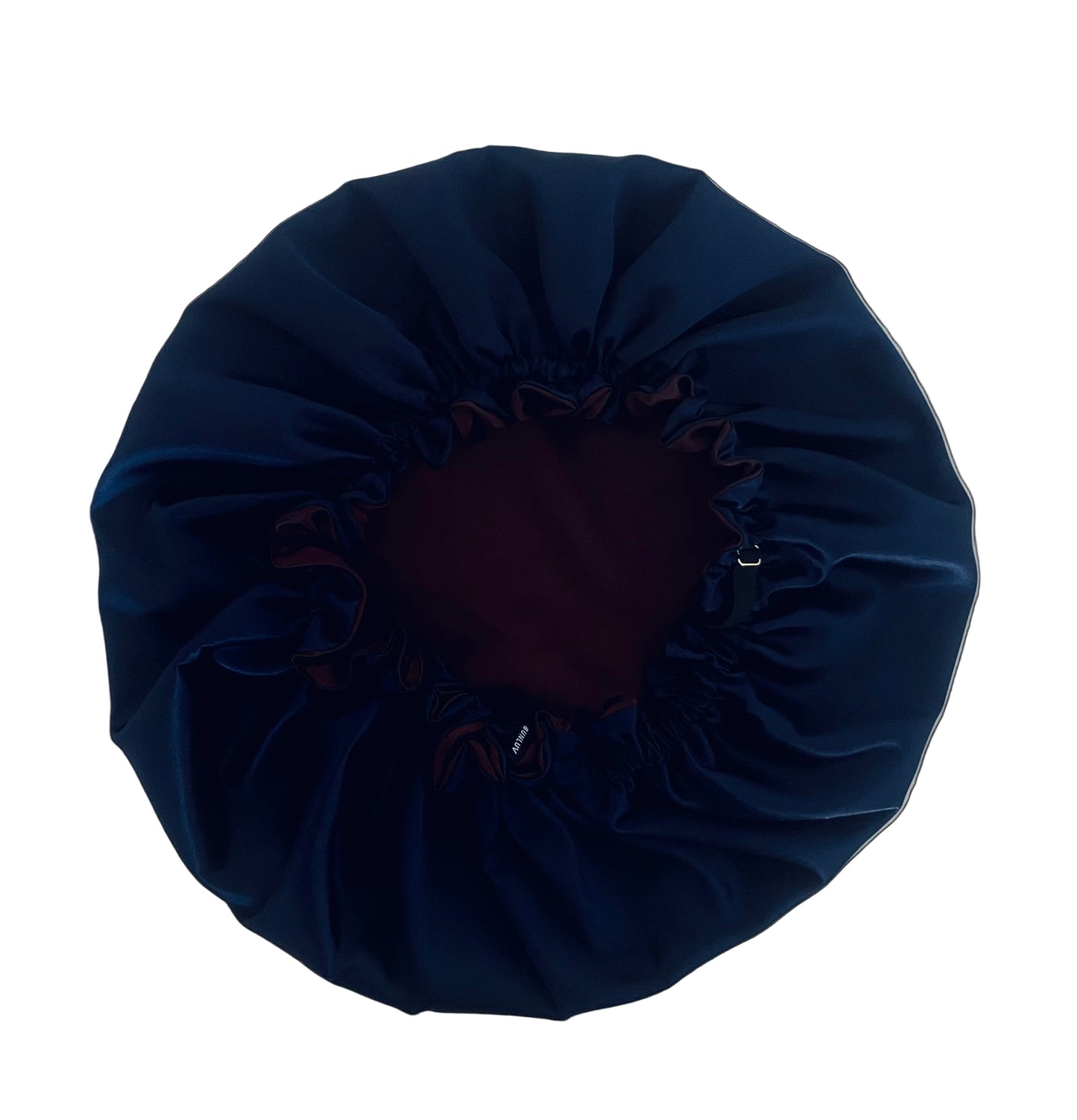 dark chocolate and navy blue satin hair bonnet on a white table BUNLUV brand 