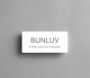 White rectangular label with 'BUNLUV' and tagline on a gray background
