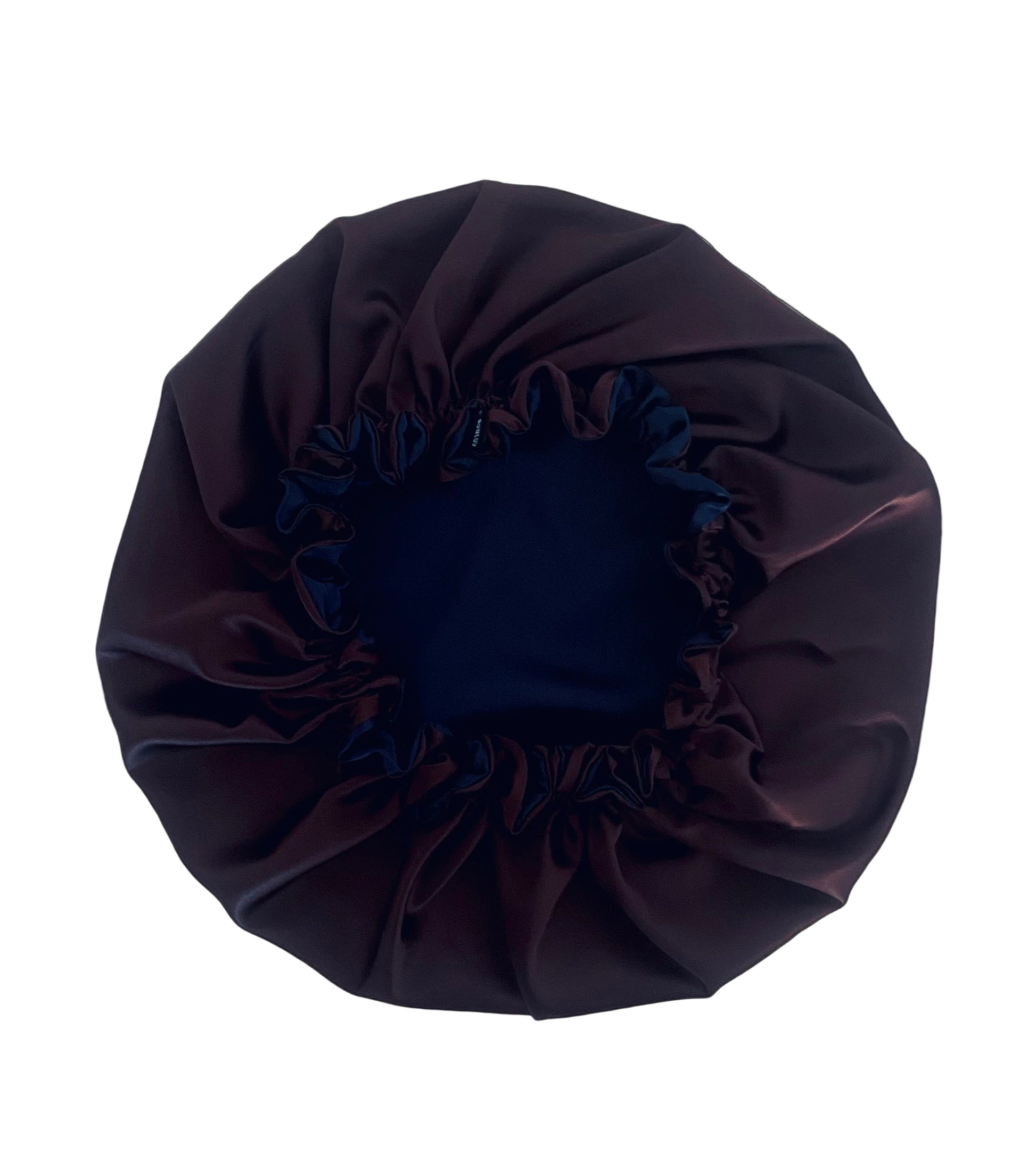 dark chocolate and navy blue satin hair bonnet on a white table BUNLUV brand 
