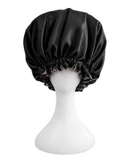 black and rose gold satin sleep bonnet on mannequin white background