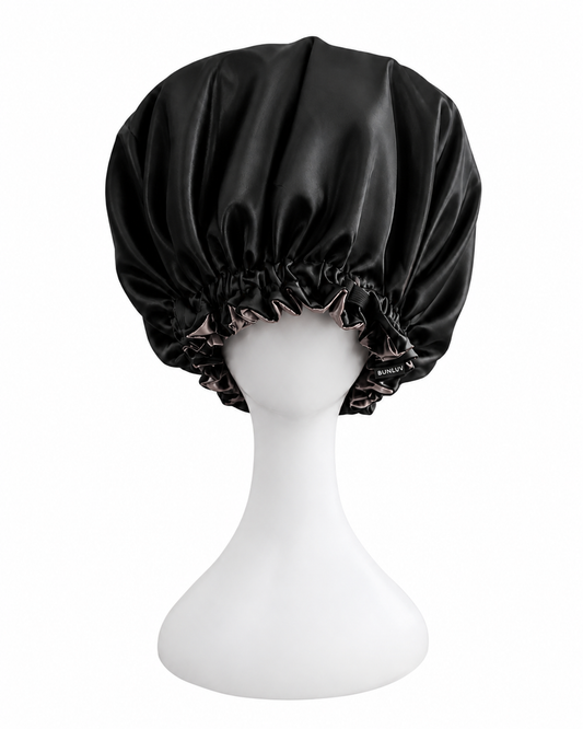 black and rose gold satin sleep bonnet on mannequin white background