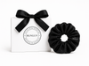 Black mulberry silk scrunchie by BUNLUV close-up on white background