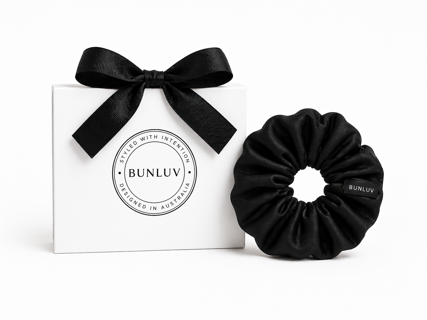 Black mulberry silk scrunchie by BUNLUV close-up on white background