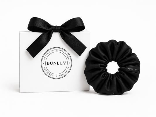 Black mulberry silk scrunchie by BUNLUV close-up on white background