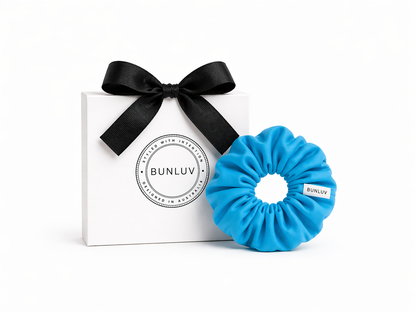 Light blue swim scrunchie by BUNLUV, shown with gift box
