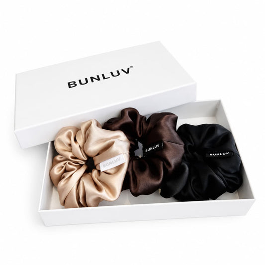 Three BUNLUV mulberry silk smartcore spiral scrunchies black, dark chocolate and nude in a BUNLUV gift box
