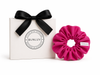 Hot pink active scrunchie by BUNLUV, shown with gift box