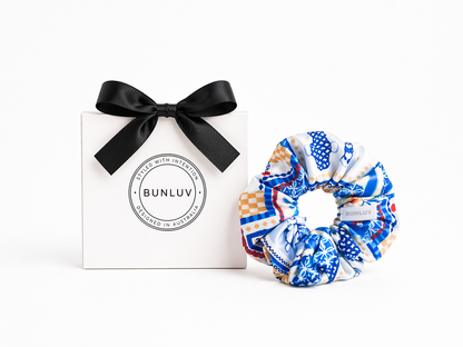 Mediterranean blue swim scrunchie by BUNLUV, shown with gift box