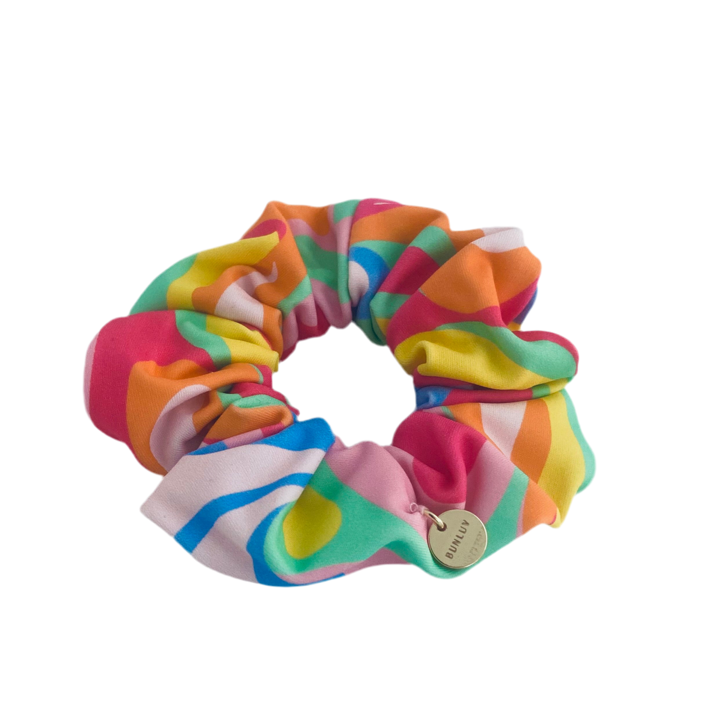 rainbow swim scrunchie with a brand tag on a white background