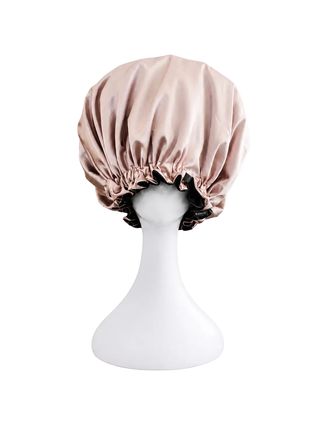 rose gold and black satin bonnet on a white mannequin head against a white background