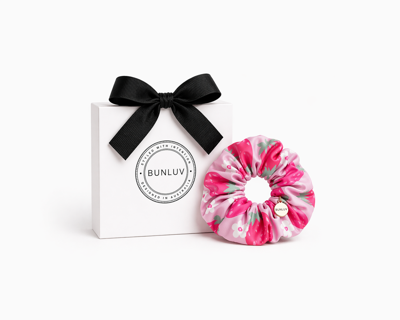 Pink strawberry print swim scrunchie by BUNLUV, shown with gift box
