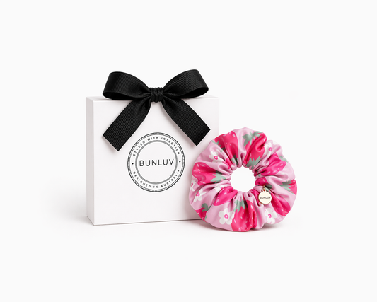 Pink strawberry print swim scrunchie by BUNLUV, shown with gift box