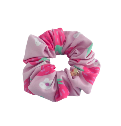 Pink strawberry print swim scrunchie by BUNLUV, on white background
