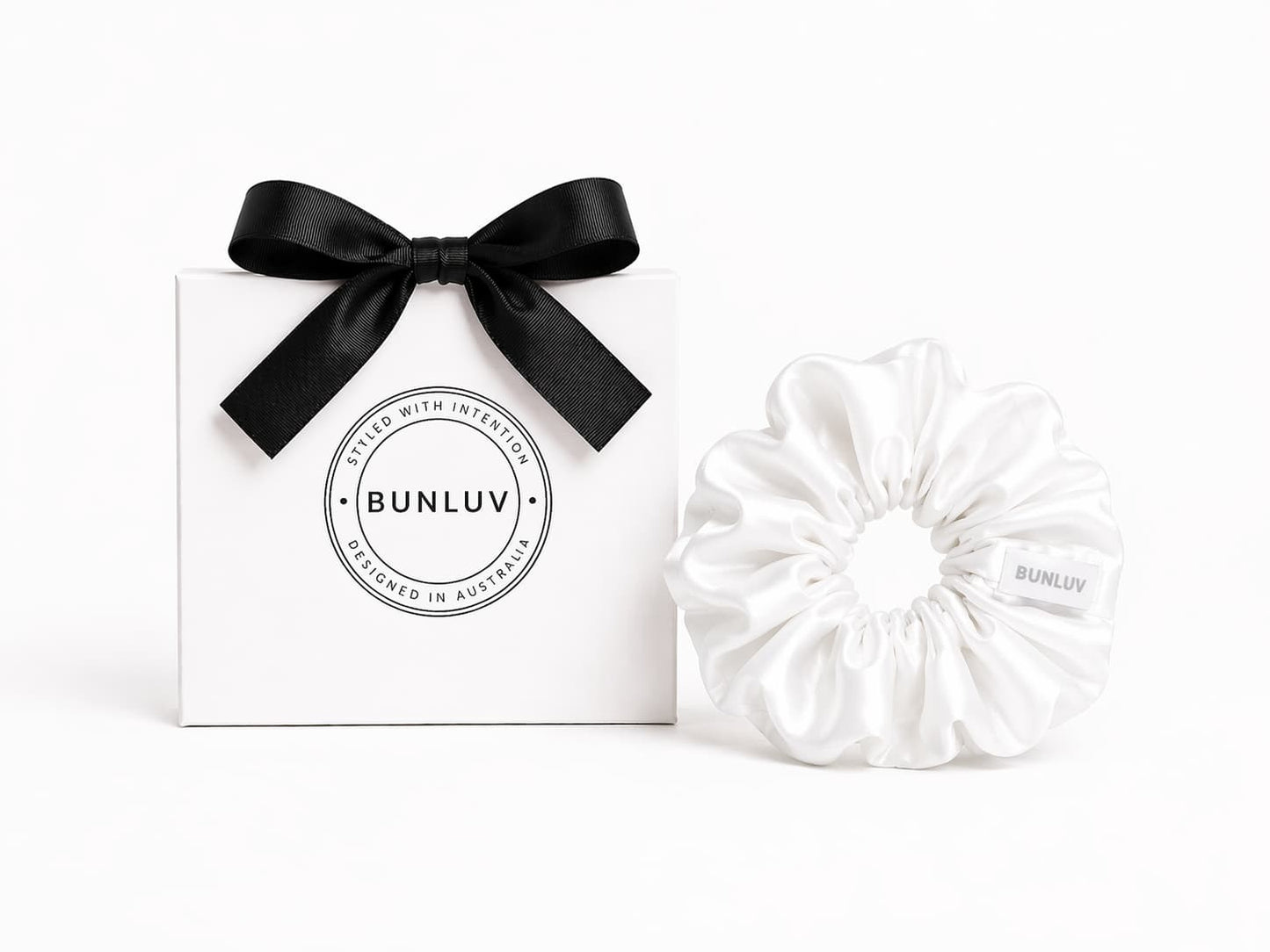 White swim scrunchie by BUNLUV, shown with gift box