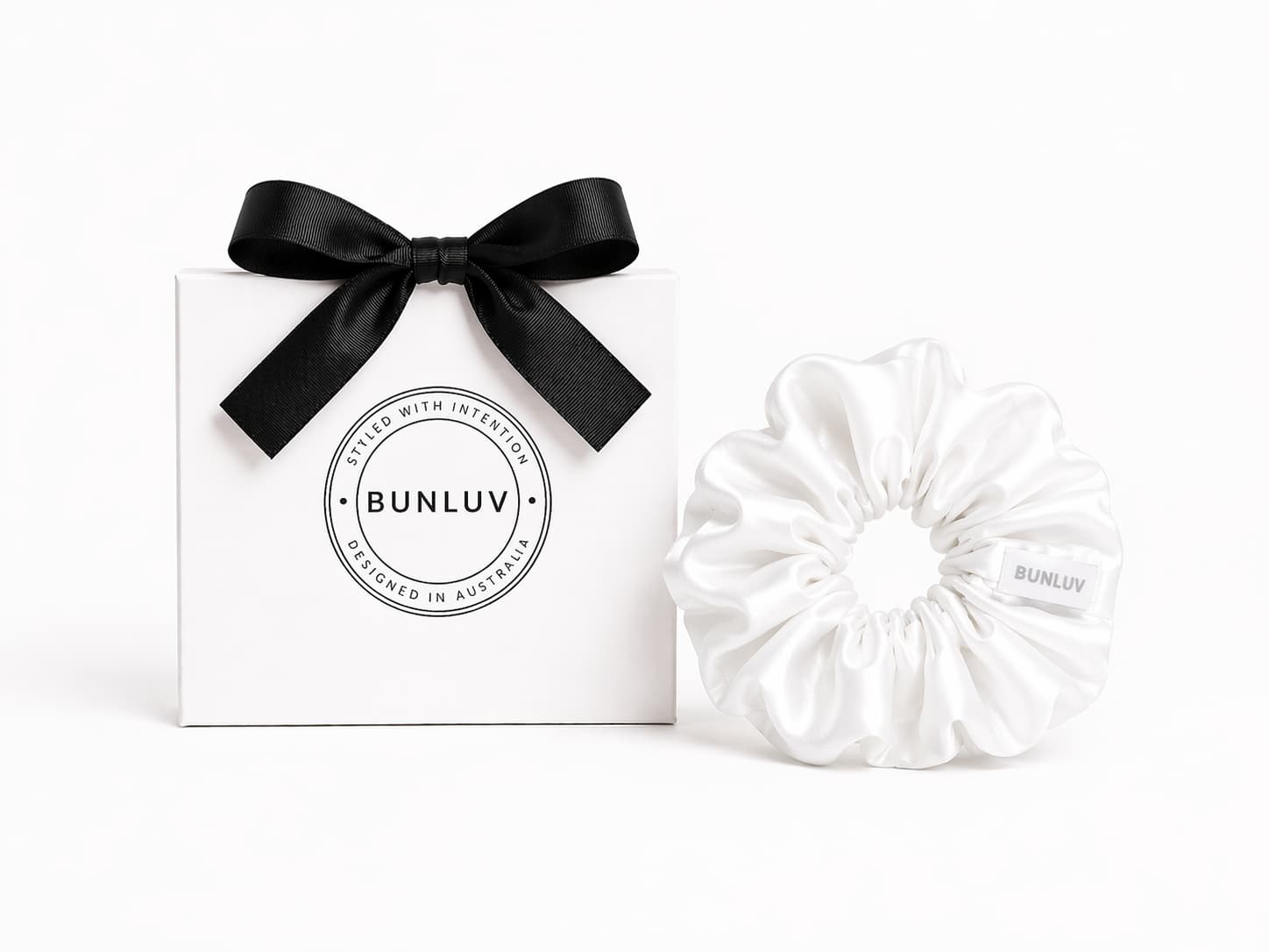 White swim scrunchie by BUNLUV, shown with gift box