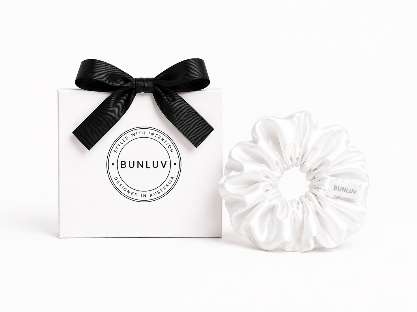 White swim scrunchie by BUNLUV, shown with gift box