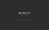 A dark charcoal gift card with centered white text reading 'BUNLUV GIFT CARD' and smaller text 'HAIR, HELD WITH INTENTION' plus 'BUNLUV.COM.