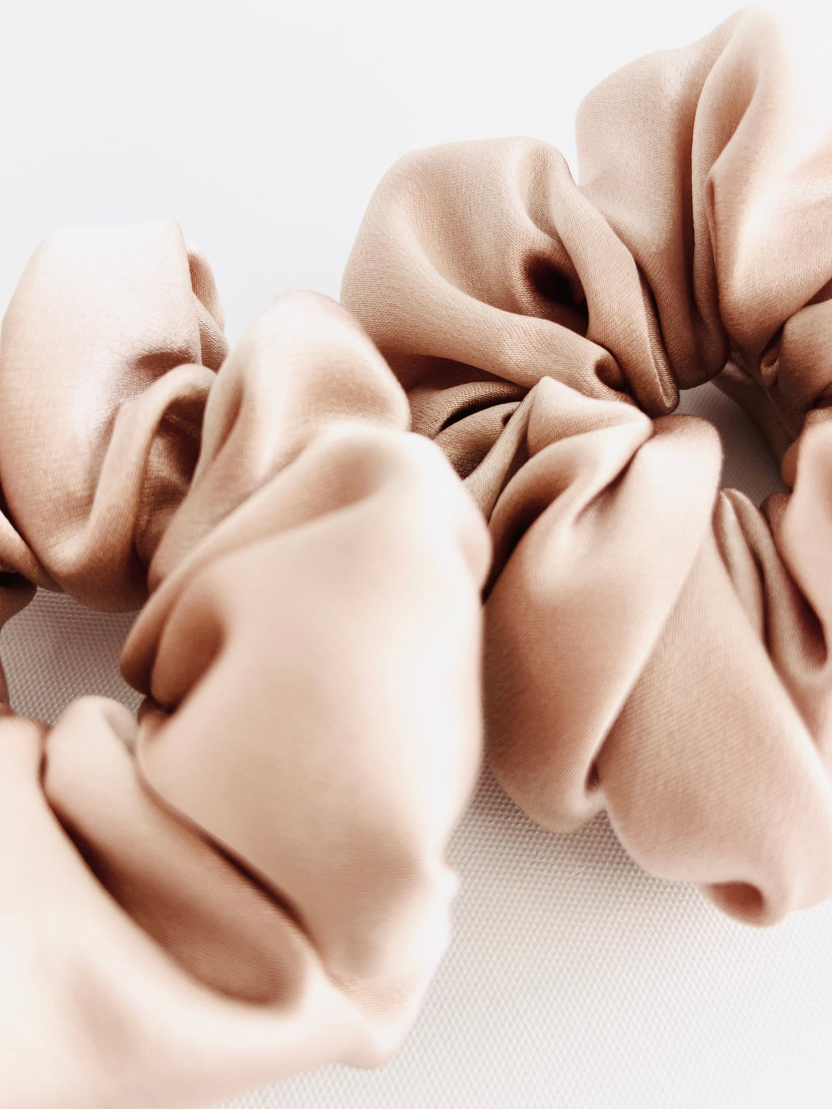 Set of 3 nude mulberry silk bunluv smartcore scrunchies close up