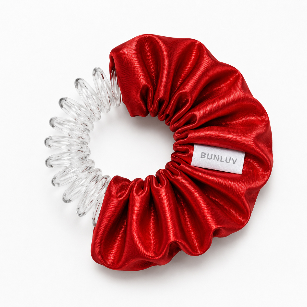 satin red scrunchie with clear spiral design on a white background, by BUNLUV