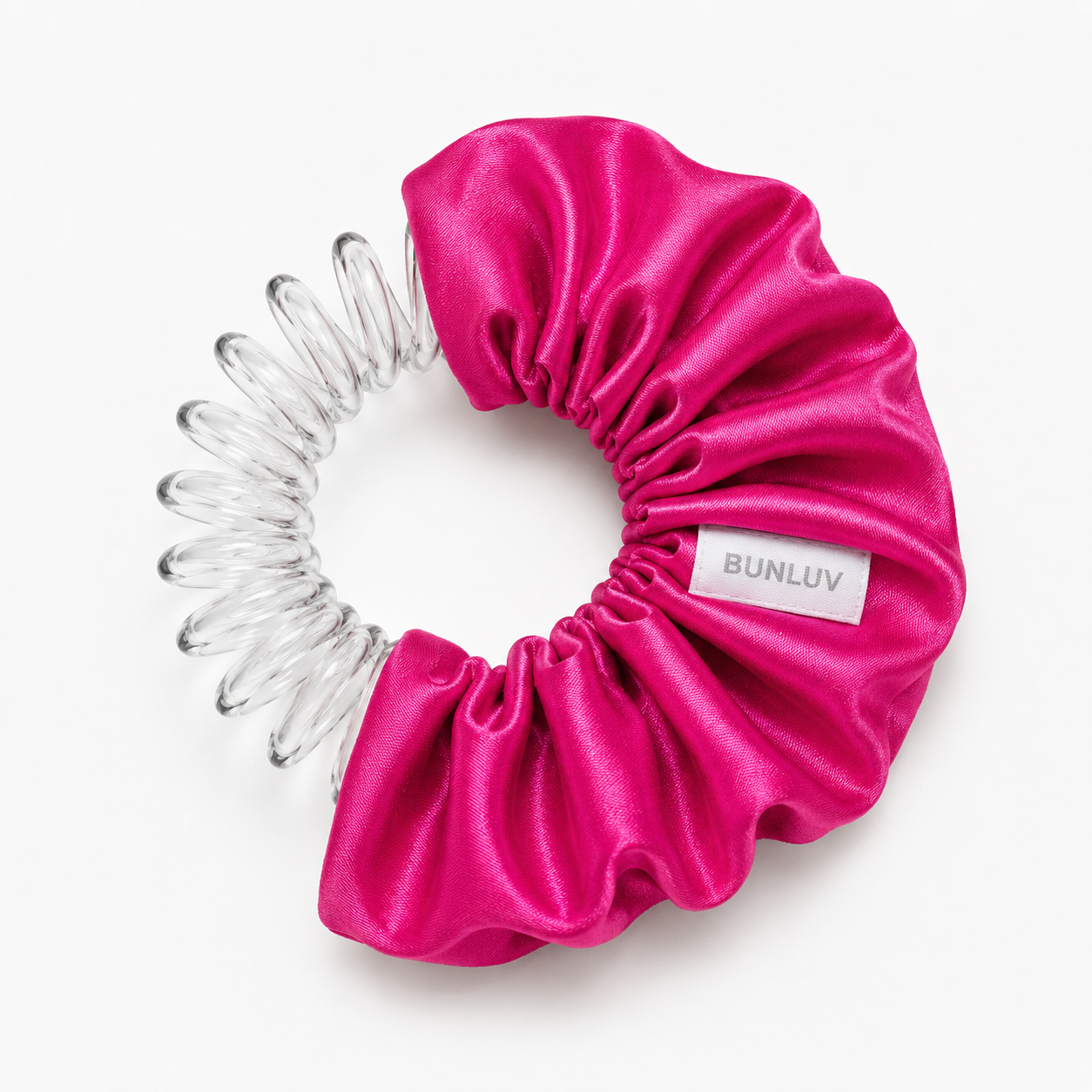 pink satin scrunchie with clear spiral design on a white background, by BUNLUV