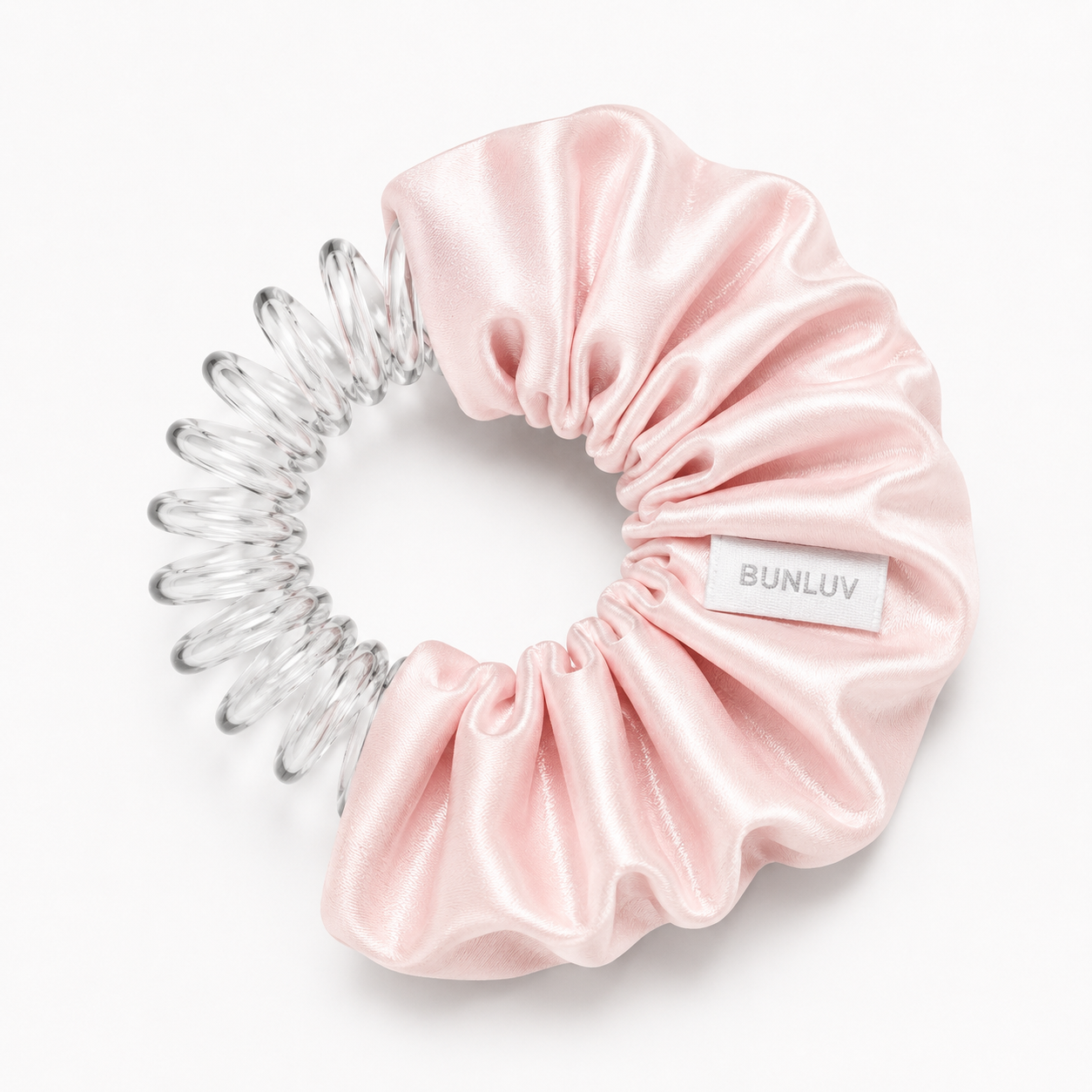 satin pink scrunchie with clear spiral design on a white background, by BUNLUV